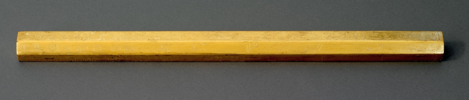 A royal cubit rod from ancient Egypt: a straight rod of gilded wood, about 3,400 years old, made in the time of the pharaoh Amenhotep II